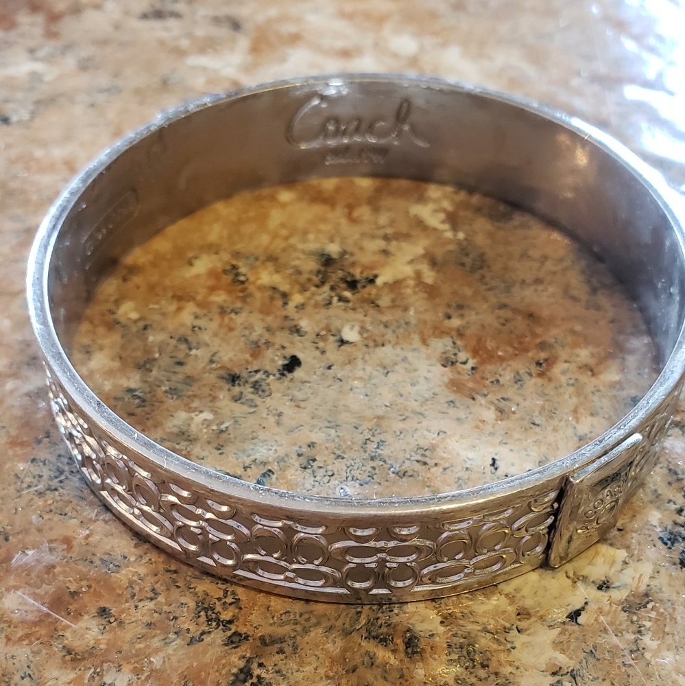 Authentic silver signature coach bangle